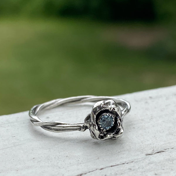 The organic nature this is ring makes it a one of a kind.  Made with a sparkly 3mm faceted Sky Blue Topaz and Sterling Silver, it can be worn by itself or stacked with other rings.  Size 8.5