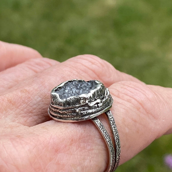 Oh!  The sparkle these bits of crystal make as your hand moves.  The trendy, large ring features a textured Sterling Silver split ring band and a layered freeform Sterling Silver bezel.  Almost 17mm around and 7mm deep this is a standout ring!  Size 8.5