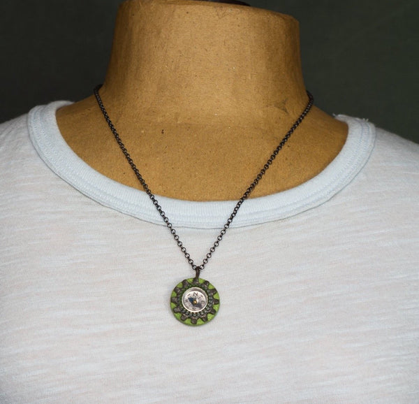 It works!  I know because I had to use my compass necklace one day when I got lost on my bike and didn't have my phone to guide me home!  The compass on this handmade necklace is surrounded by a zipper and a locking tooth washer and sewn to a painted wood and paper support.
