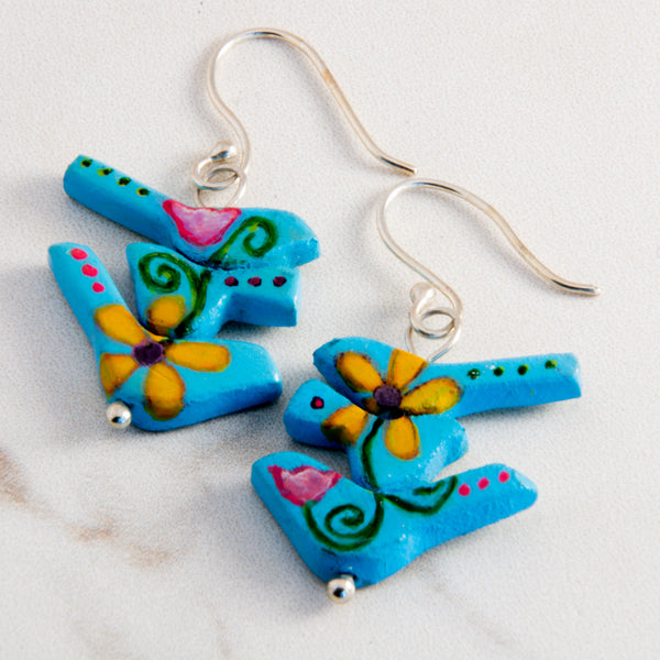 The birds in these handmade earrings wanted a new beginning, a new opportunity and a new trail to travel so they morphed out of a rulerdom and became a tribe of flower power birds.