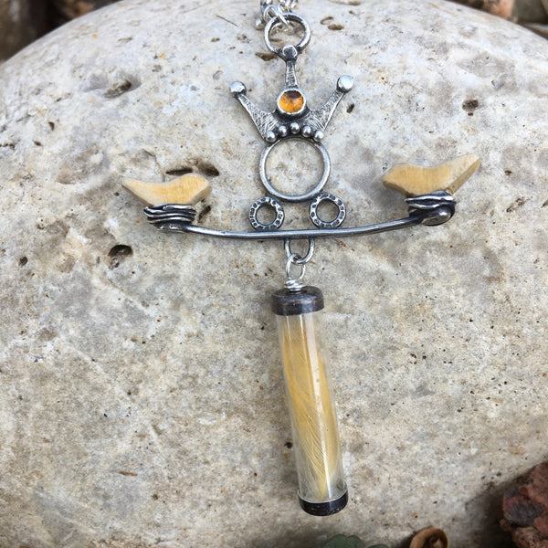 “When the Sun of compassion arises...the singing birds come from nowhere.”  ― Amit Ray  A tiny, found yellow feather, birds made from vintage rulers and a Goddess reaching her hands to hold them with love.  The 3mm Citrine is said to harness the energy of the sun and brings light to all areas of life.  Textured and patinated Sterling Silver and Argentium™.  Chain:  16"L, Sterling Silver Rolo Chain, Lobster Clasp  Charm:  2 1/2"L x 1 3/4"W