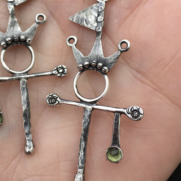 Let the world know you are flying your Flag of Peace and Summer Spirit while wearing the Sterling Silver and Argentium™ earrings.  A stone of compassion, the 3mm Peridot offers many gifts.  The bright, inviting green stone can inspire creativity and delight along with calm and safety.  Total length with ear wire:  2 1/2" long  Charm Size:  1 3/4"L x 15/16"W