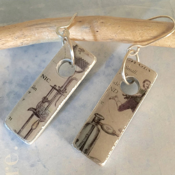 It's that kind of day!  Or any kind of day to wear these earrings made from found object metal, a Hendricks Gin Label and sealed with resin.