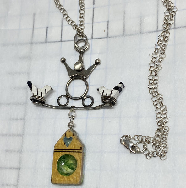 The wonderful song by They Might Be Giants led to this piece about birds and birdhouses and what lives in your soul.  Does this necklace express the beauty that lies in your soul?   Patinated Sterling Silver, Argentium™,  3mm bezel-set Moonstone, hand painted, rulers.  Chain:  16" Patinated Sterling Silver 1.5mm Rolo Chain, Spring Clasp  Charm:  1 1/4"L x 1 1/2"W   Moonstone is associated with the inner feminine goddess and offers new beginnings while releasing all kinds of love.