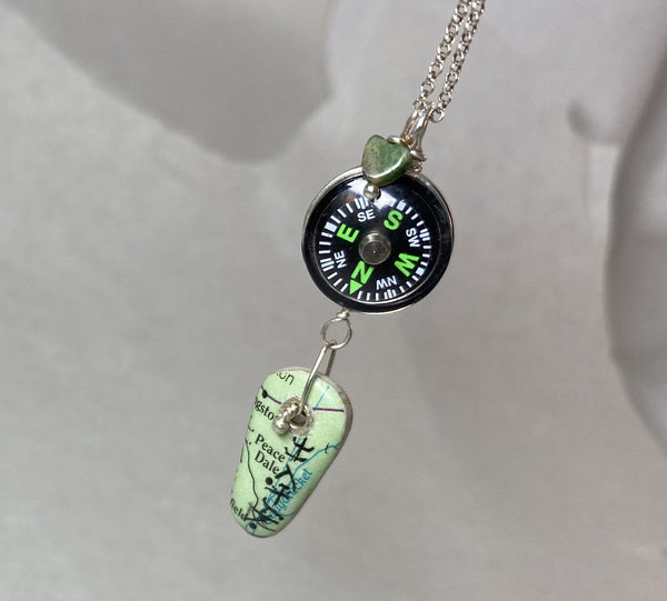 "May you be blessed with peace and safety wherever you are" reads the Asian Script painted on a map of Peace Dale.  A compass helps guide you as you journey into uncharted days.  The Fancy Jasper heart offers protection on your travels.  I love this saying so much that I make this necklace over and over.   Each piece is the same but different and a one of a kind in its own way making it personal to the wearer.  Charm:  1 7/8"  Chain:  16" Sterling Silver