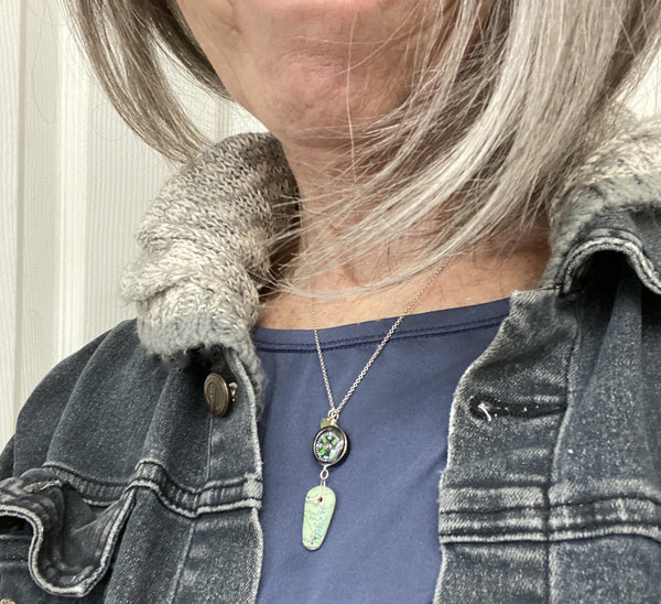 "May you be blessed with peace and safety wherever you are" reads the Asian Script painted on a map of Peace Dale.  A compass helps guide you as you journey into uncharted days.  The Fancy Jasper heart offers protection on your travels.  I love this saying so much that I make this necklace over and over.   Each piece is the same but different and a one of a kind in its own way making it personal to the wearer.  Charm:  1 7/8"  Chain:  16" Sterling Silver