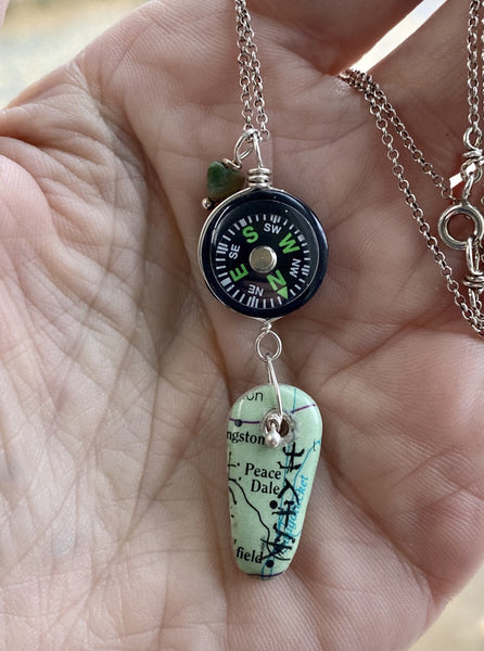 "May you be blessed with peace and safety wherever you are" reads the Asian Script painted on a map of Peace Dale.  A compass helps guide you as you journey into uncharted days.  The Fancy Jasper heart offers protection on your travels.  I love this saying so much that I make this necklace over and over.   Each piece is the same but different and a one of a kind in its own way making it personal to the wearer.  Charm:  1 7/8"  Chain:  16" Sterling Silver