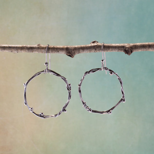 Each pair of handmade metal hoops in this style are one of a kind.  While similar to each other, the process of making them is organic and the outcome is unpredictable.  This is also true of each set of earrings.  While not perfectly matched, they are visually balanced.