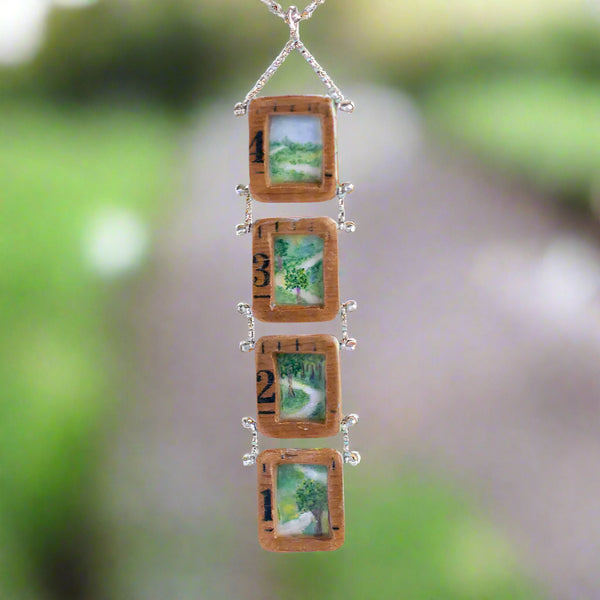 Life...a meandering path.  Sometimes the way is crystal clear and other times we strive to pick it up when it falls off the page.  If we trust our knowing, if we trust the journey, we will end up right where we are to be.  The hand-painted path is framed in vintage rulers and backed with map paper.