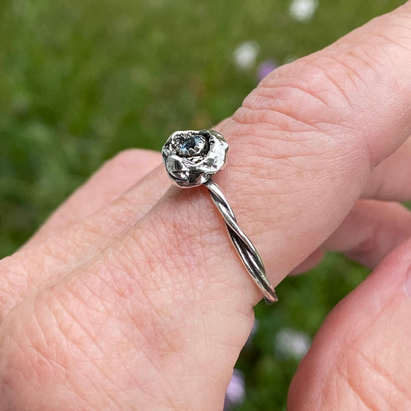 The organic nature this is ring makes it a one of a kind.  Made with a sparkly 3mm faceted Sky Blue Topaz and Sterling Silver, it can be worn by itself or stacked with other rings.  Size 8.5