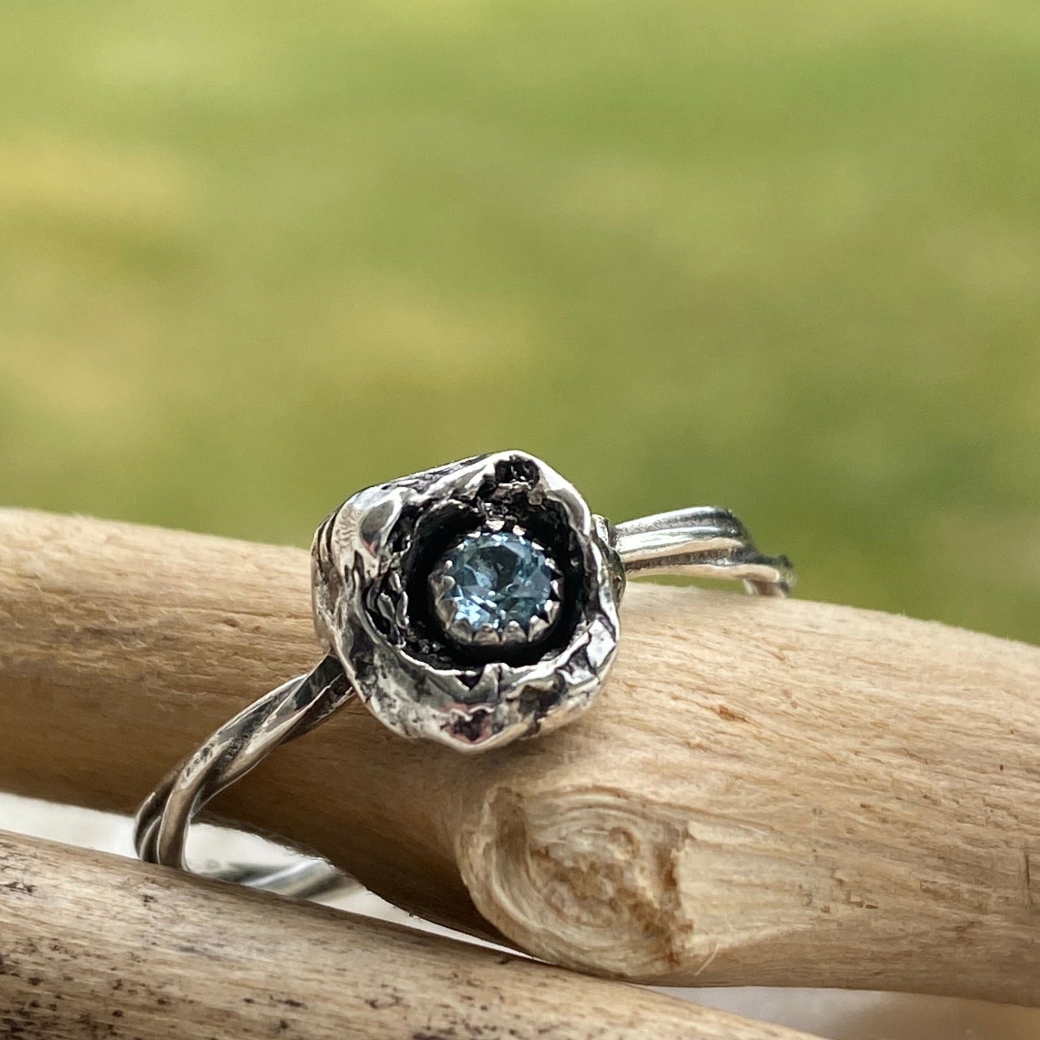 The organic nature this is ring makes it a one of a kind.  Made with a sparkly 3mm faceted Sky Blue Topaz and Sterling Silver, it can be worn by itself or stacked with other rings.  Size 8.5