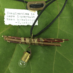Einstein said ”Imagination is more important than knowledge.”  This quote is stamped on the brass band that encircles a bundle of sticks.  A small vintage lightbulb dangling on a brass chain represents that “aha” moment when imaginings fall together and become knowledge.  Chain Length - 36" long, 2mm brass ball chain and clasp.  Can be worn long or short.  Charm Size - 1 1/2" long x 2" wide   Total Length - 19 1/2" expands to 37 1/2"