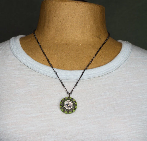It works!  I know because I had to use my compass necklace one day when I got lost on my bike and didn't have my phone to guide me home!  The compass on this handmade necklace is surrounded by a zipper and a locking tooth washer and sewn to a painted wood and paper support.  