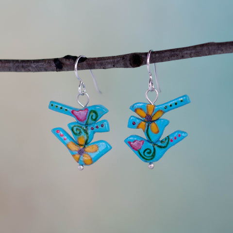 The birds in these handmade earrings wanted a new beginning, a new opportunity and a new trail to travel so they morphed out of a rulerdom and became a tribe of flower power birds.