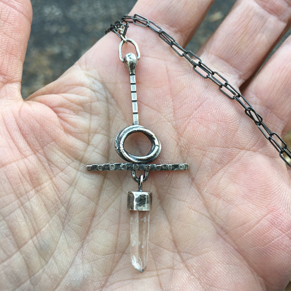  Quartz crystal can help your soul connect to the stars.  Handmade with Argentium™ this unique piece was created from thoughts of peace and balance.  Chain:  21 1/2" patinated Sterling Silver oval cable chain  Charm:  2 1/4" long x 1" wide