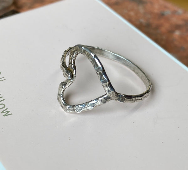 Dots, texture and patina are combined to create this delicate yet sturdy Sterling Silver ring that is all about love.  Size 7