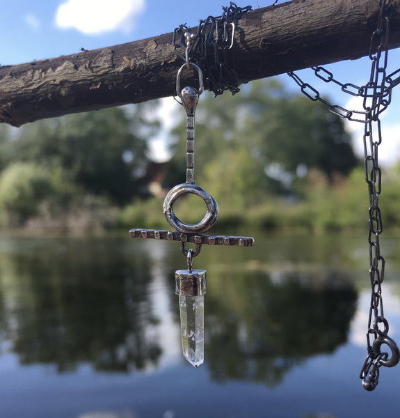  Quartz crystal can help your soul connect to the stars.  Handmade with Argentium™ this unique piece was created from thoughts of peace and balance.  Chain:  21 1/2" patinated Sterling Silver oval cable chain  Charm:  2 1/4" long x 1" wide