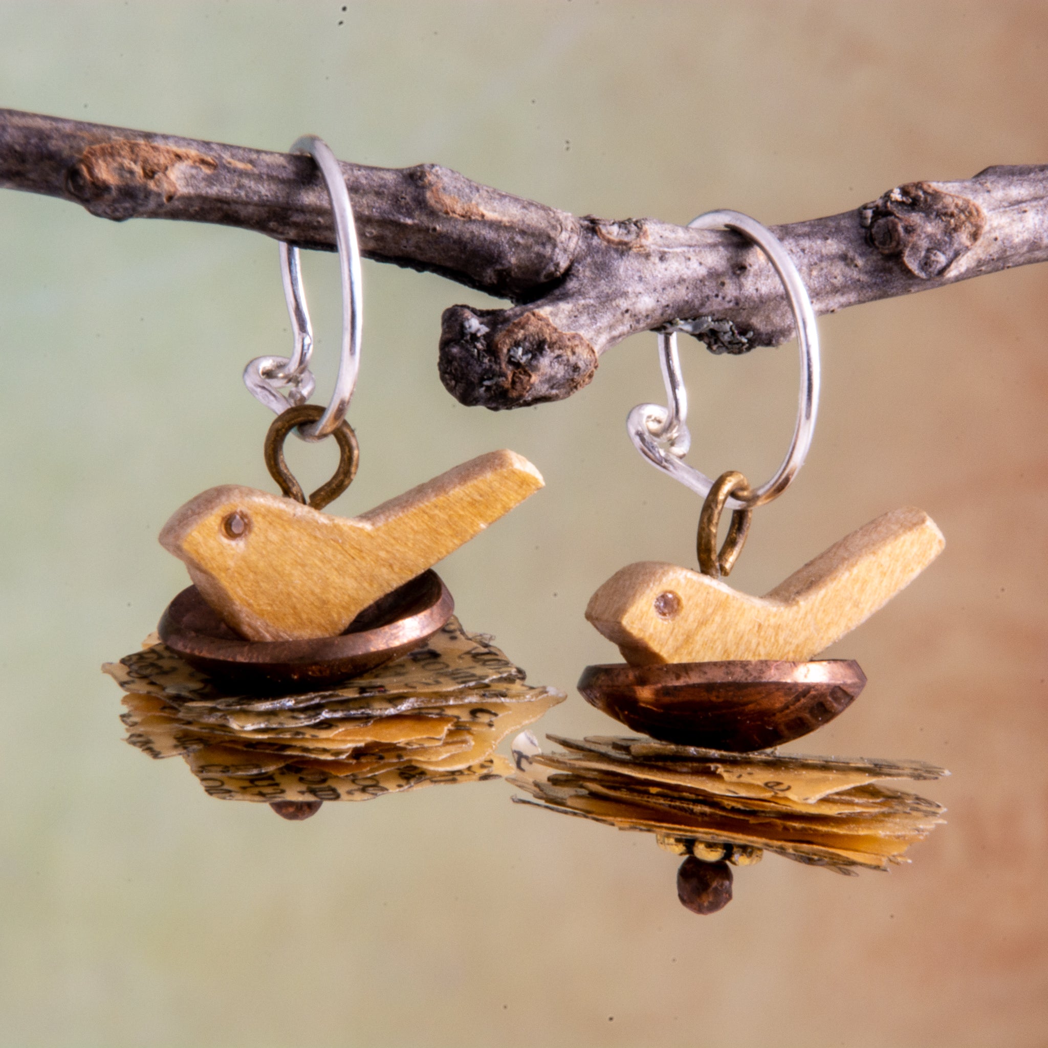 A penny for the thoughts of the mama birds as they sit in their nests of these handmade earrings.   Perhaps they are thinking of love, hope and joy which is symbolized by their White Topaz eyes.